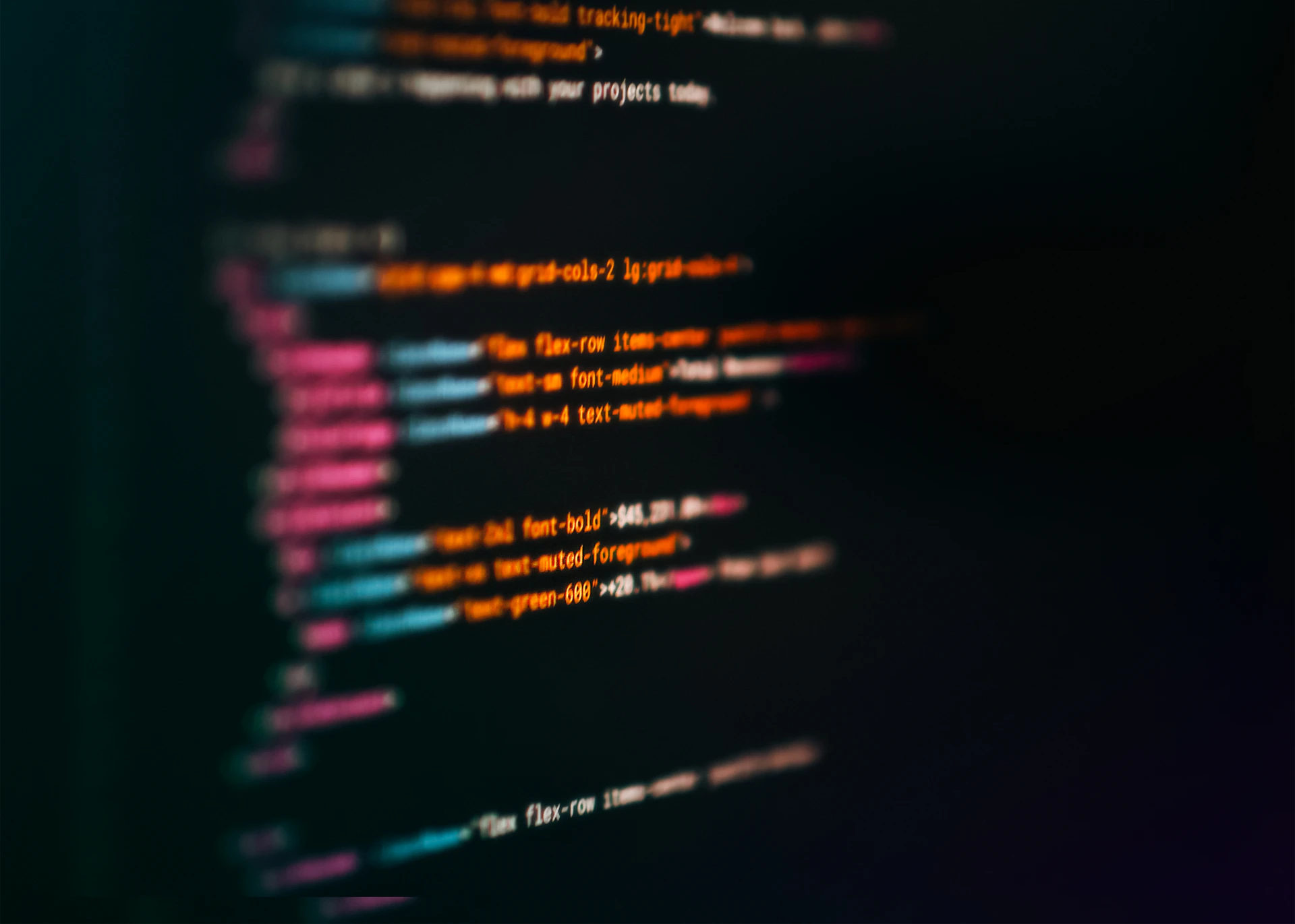 Close-up of blurred programming code on a screen
